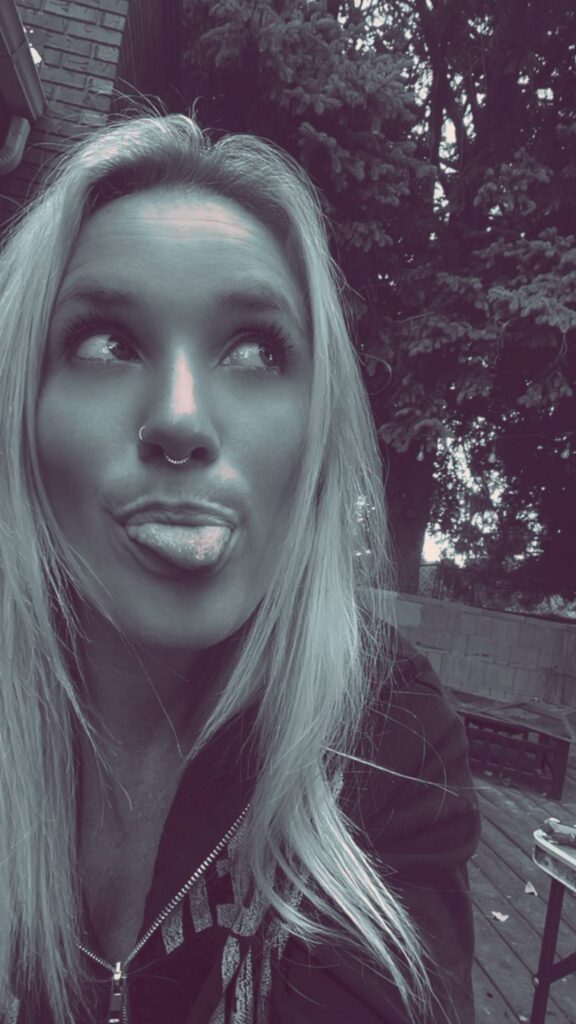 Nikyla pulling a face at the camera outdoors.