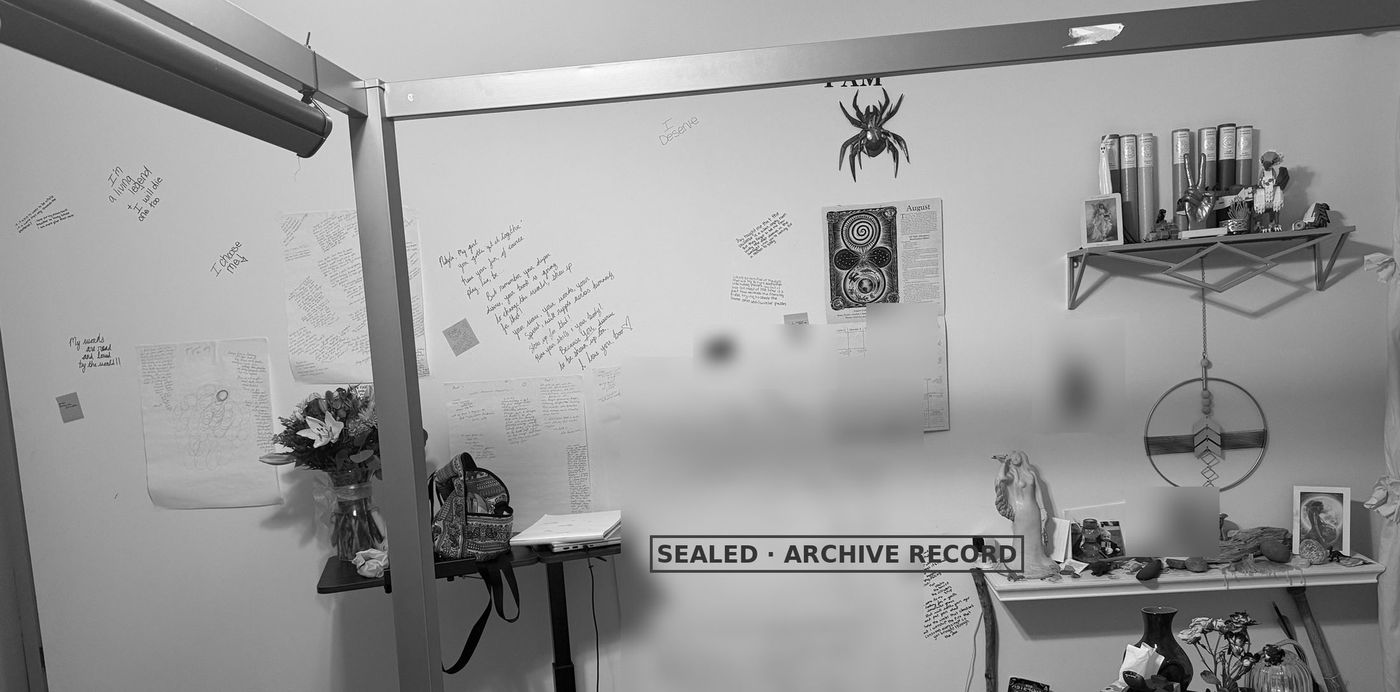 An older black-and-white photograph of the bedroom wall: letters and poems written straight onto the paint, taped sheets, a moon calendar, a rubber spider.